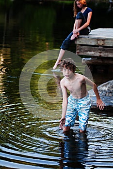 Boy playing in a lake