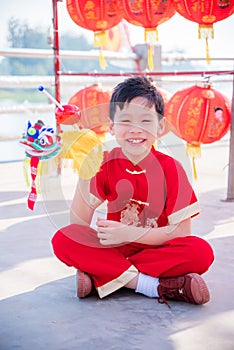 Boy playing lion puppet in chinese new year festival
