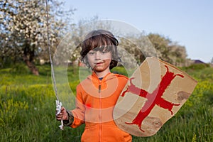 Boy playing in medieval knight