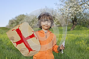 Boy playing in medieval knight