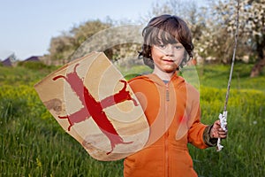 Boy playing in medieval knight