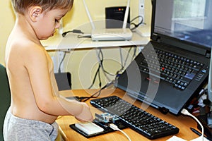 Boy playing with microcontroller