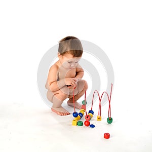Boy playing with multicolored cubes and curl isola