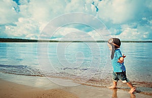 Boy playing with a paper plane in aviator hat