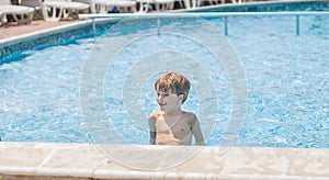 Boy playing in a pool