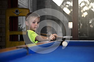 Boy playing pool