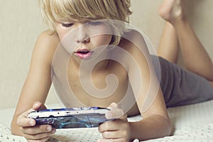 Boy playing on the PSP