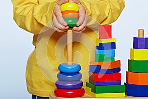 Boy playing with pyramid