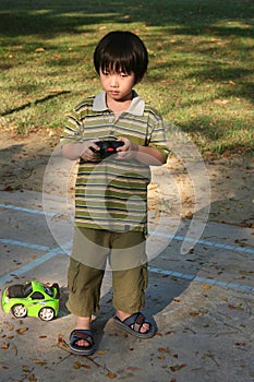 Boy playing remote control car