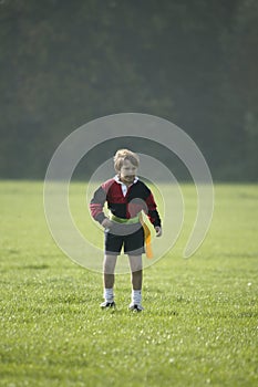 Boy playing Rugby