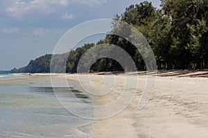 Boy playing with sand at the beach on summer,Summer holiday and vacation concept