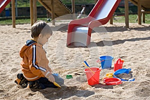 Boy playing in sand box