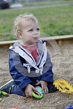 Boy playing in sandbox