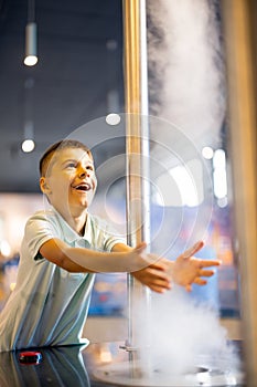 Boy playing in a science museum