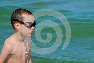 Boy playing in the sea