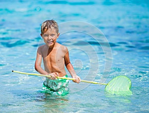 Boy playing in the sea