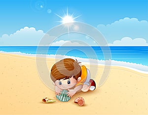 Boy playing a sea shells at the beach