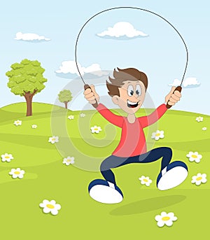 A boy playing with the skipping rope in a park