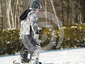 Boy playing in the snow