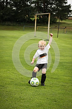 Boy playing soccer