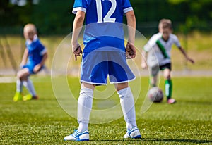 Boy Playing Soccer Football Match on a Sports Stadium. Soccer Defense Player