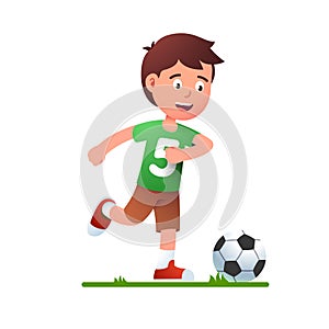 Boy playing soccer game. Kid in football uniform