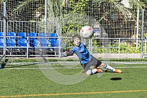 Boy playing soccer goalie