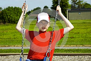 Boy Playing on Swing