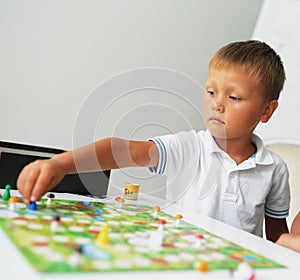 A boy playing with table game