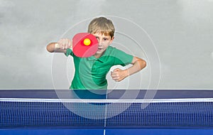 Boy playing table tennis