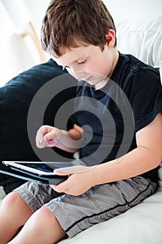 Boy playing on a tablet