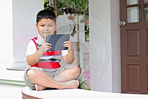 Boy playing Tablet
