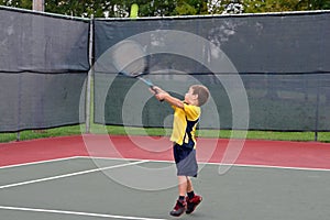 Boy Playing Tennis