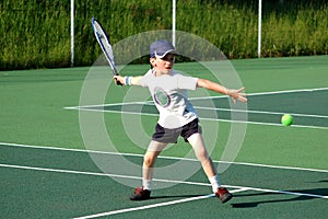 Boy playing tennis