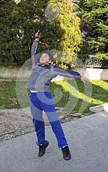 Boy playing tennis