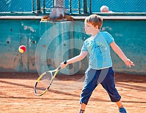 Boy playing tennis