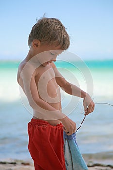 Boy playing with towel