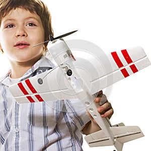 Boy playing with a toy airplane