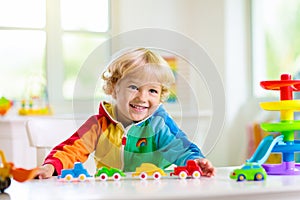 Boy playing toy cars. Kid with toys. Child and car