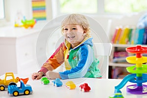 Boy playing toy cars. Kid with toys. Child and car