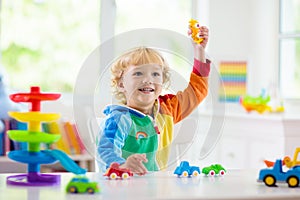 Boy playing toy cars. Kid with toys. Child and car