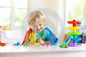 Boy playing toy cars. Kid with toys. Child and car