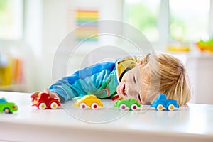 Boy playing toy cars. Kid with toys. Child and car