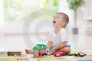 Boy playing toy cars. Kid with toys. Child and car