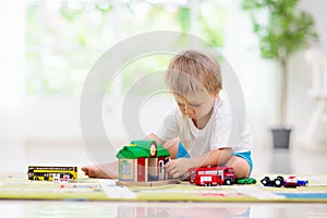 Boy playing toy cars. Kid with toys. Child and car