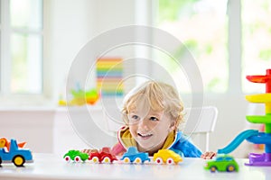 Boy playing toy cars. Kid with toys. Child and car