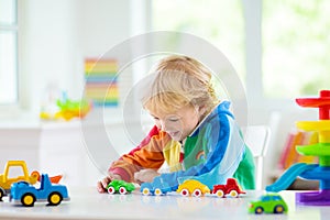 Boy playing toy cars. Kid with toys. Child and car