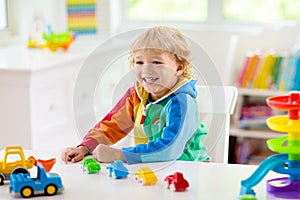 Boy playing toy cars. Kid with toys. Child and car