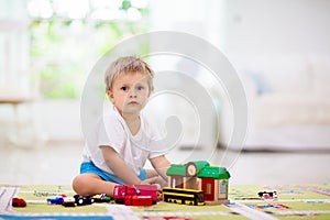 Boy playing toy cars. Kid with toys. Child and car