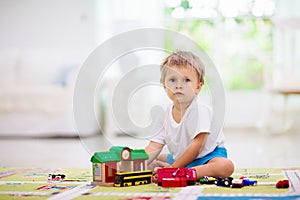 Boy playing toy cars. Kid with toys. Child and car